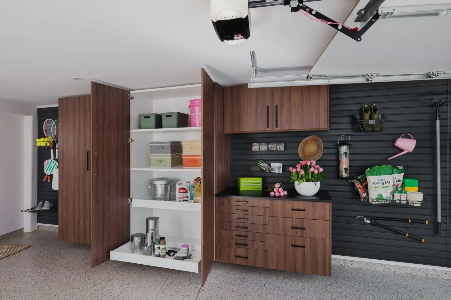 Complete custom garage storage system with cabinets, shelving, and slat-wall, Edmonton
