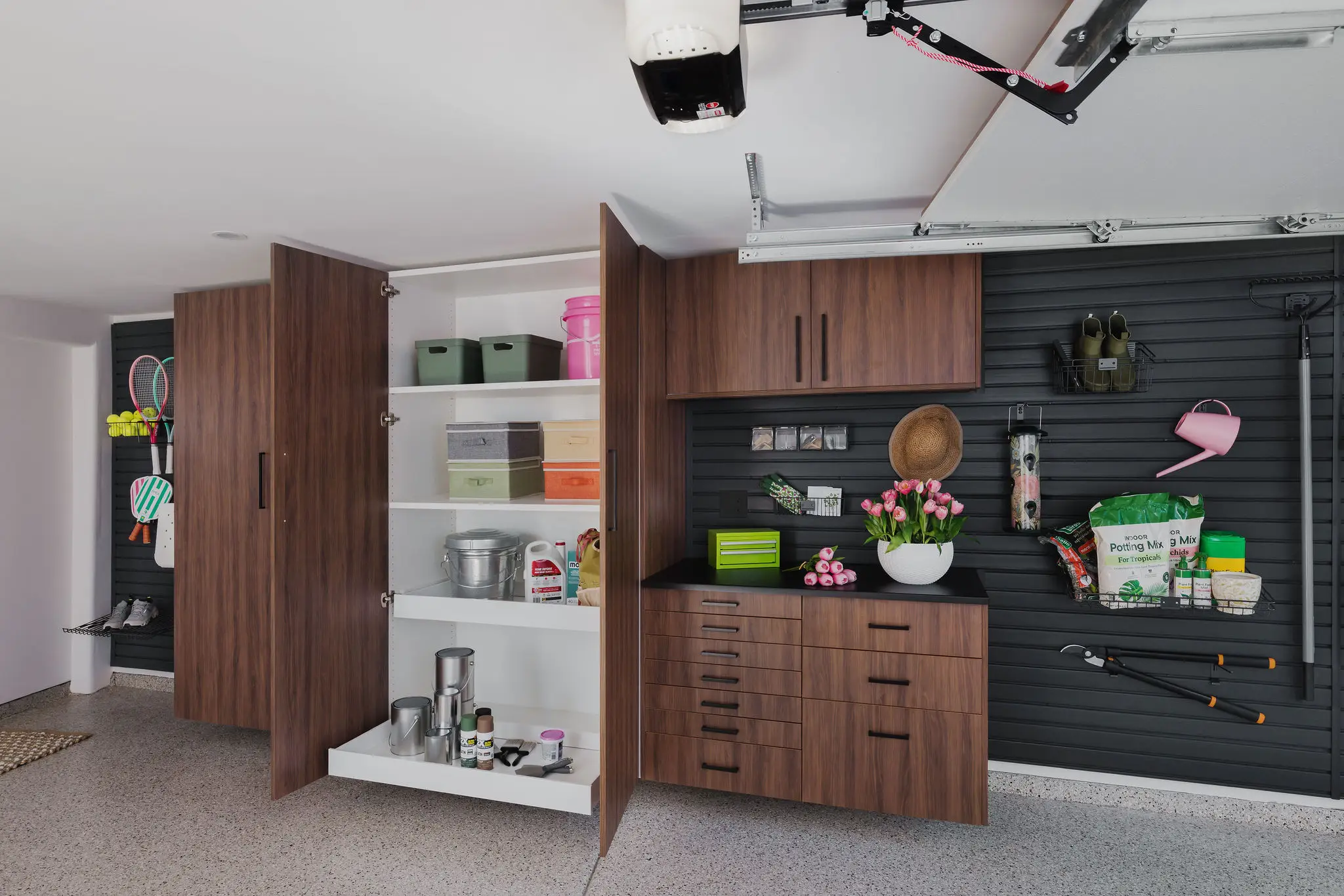 Complete custom garage storage system with cabinets, shelving, and slat-wall, Edmonton