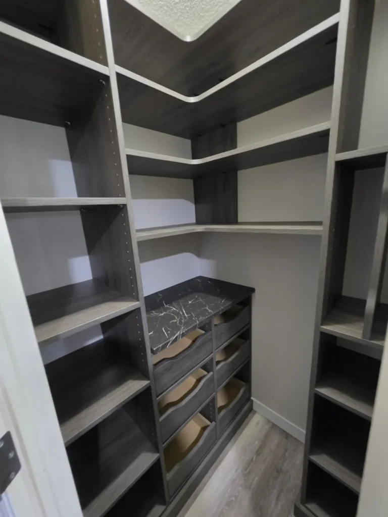 Dark woodgrain walk-in pantry in the Edmonton area, after Famille Closets installation