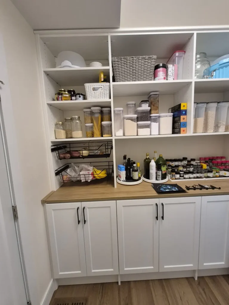 White pantry with butcher-block counter in St. Albert, after Famille Closets installation