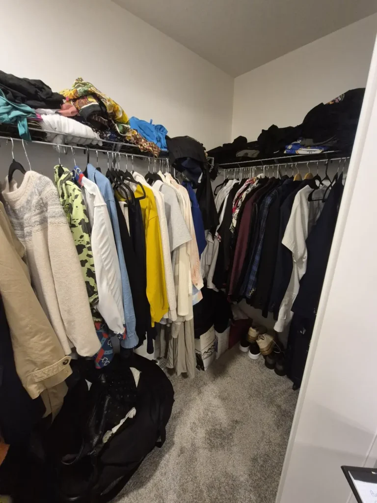 Walk-in closet in Southwest Edmonton before Famille Closets installation