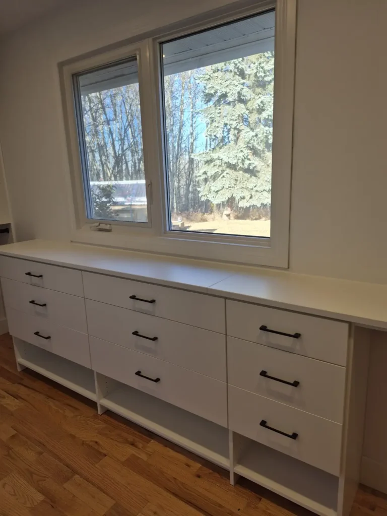 Room-sized walk-in closet with drawer bank in Spruce Grove, after Famille Closets installation