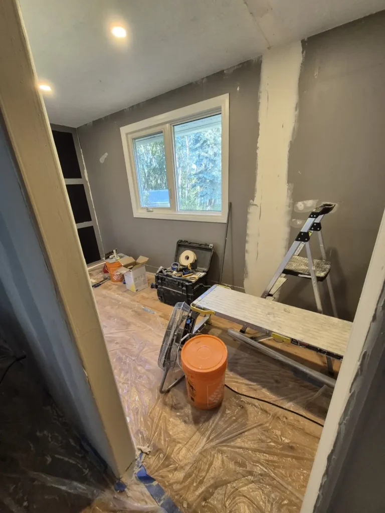 Walk-in closet in Spruce Grove before Famille Closets installation