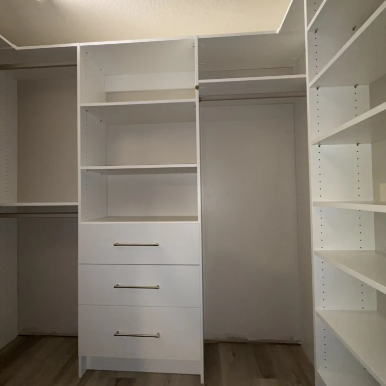 White walk-in closet with Symphony wall in Terwillegar, Edmonton, after Famille Closets installation