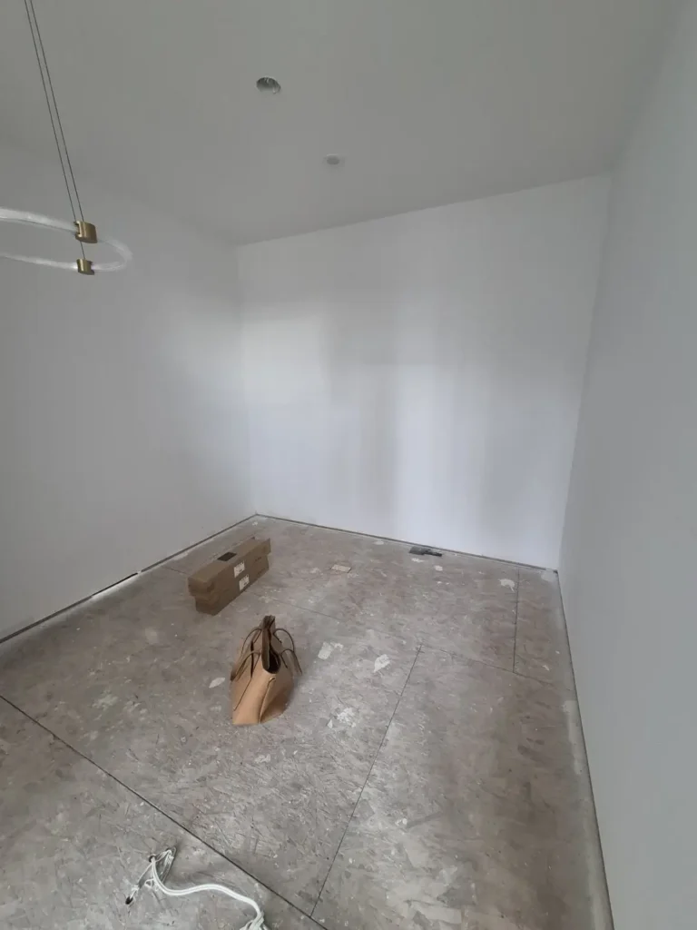 Walk-in closet in the Edmonton area before Famille Closets installation