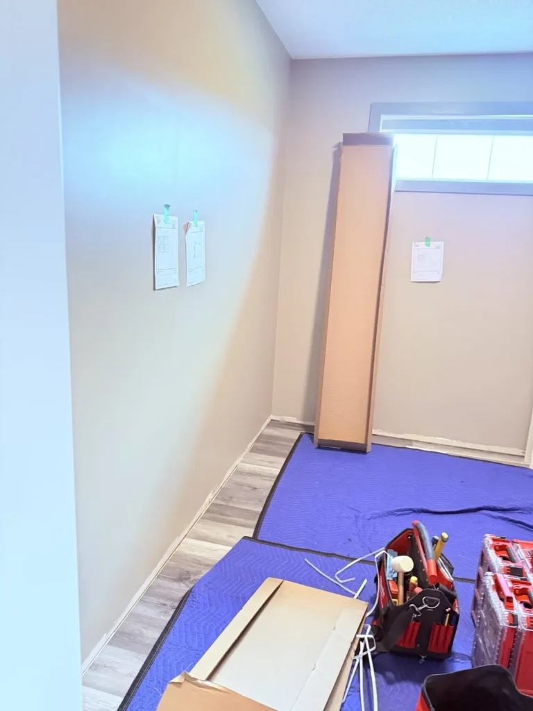 Walk-in closet in Sherwood Park before Famille Closets installation
