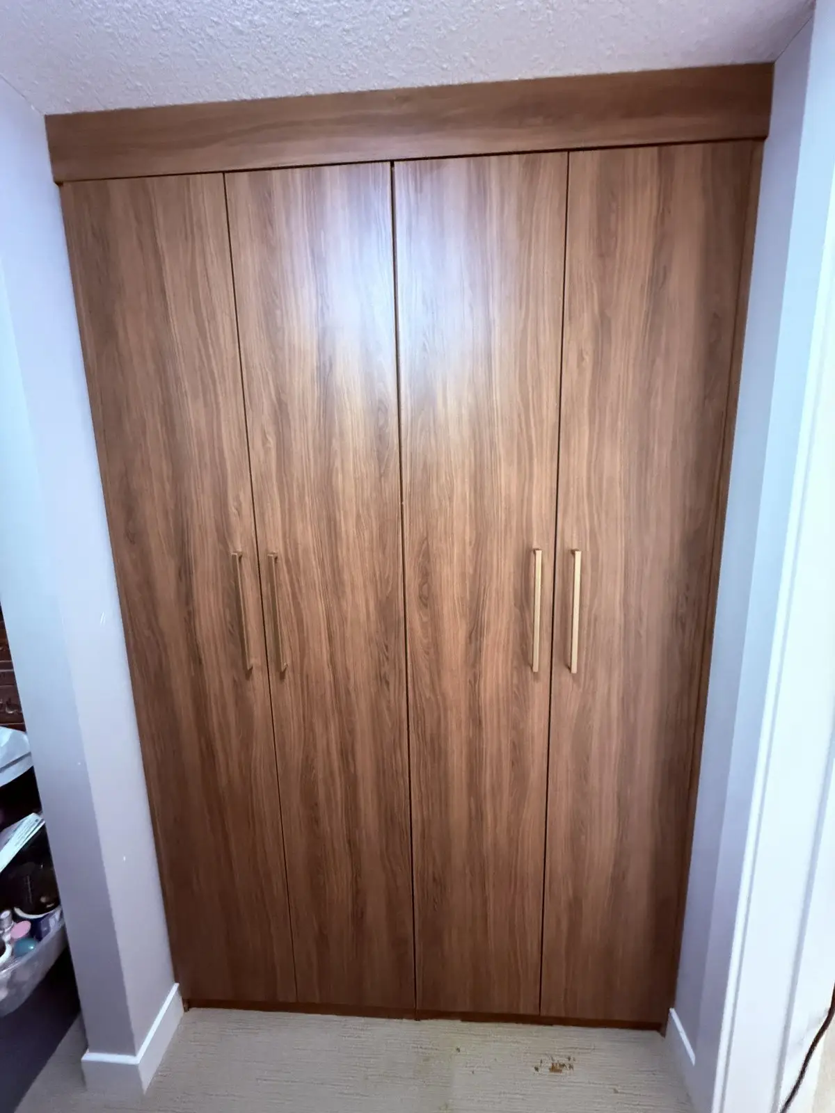 Tahoe woodgrain wardrobe with doors in the Edmonton area, after Famille Closets installation