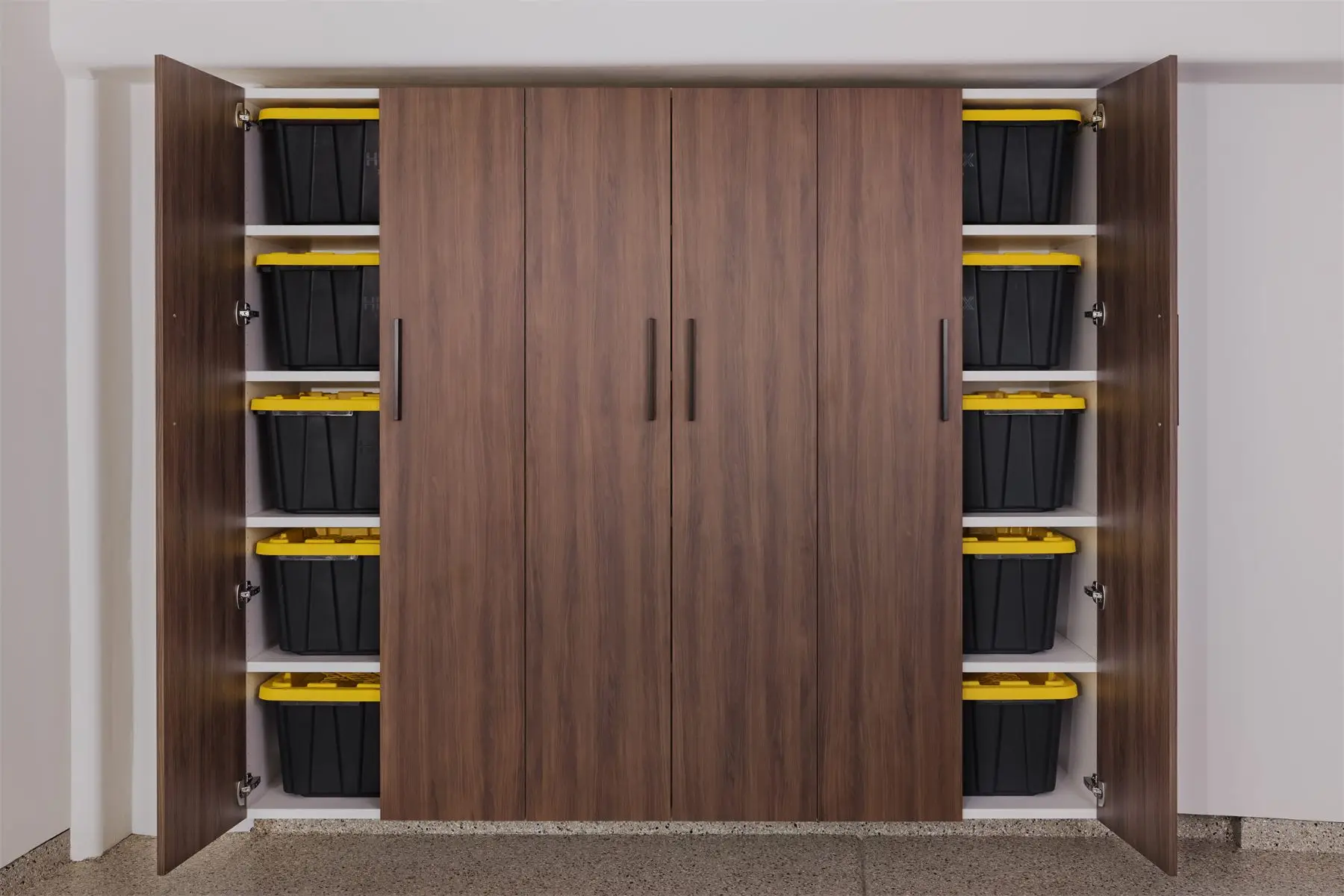 Tall garage cabinets with storage bins by Famille Closets