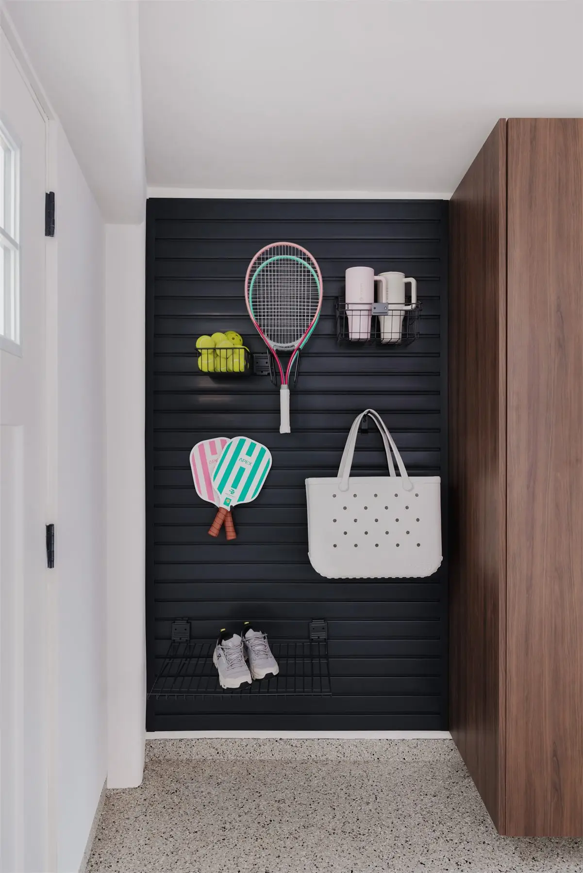 Slatwall sports equipment storage by Famille Closets