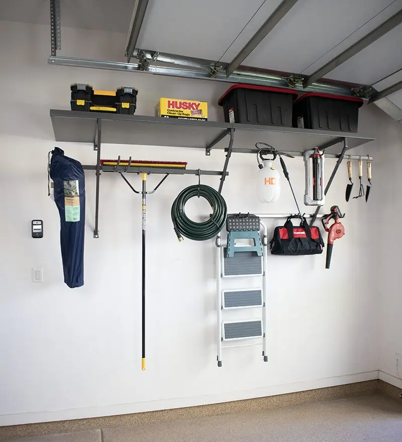 Overhead rack and wall hooks by Famille Closets