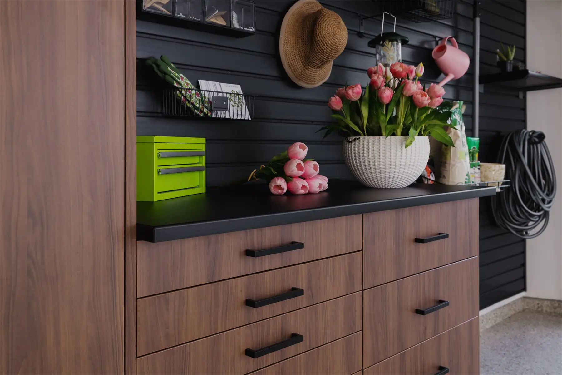 Garage workbench with dark countertop by Famille Closets