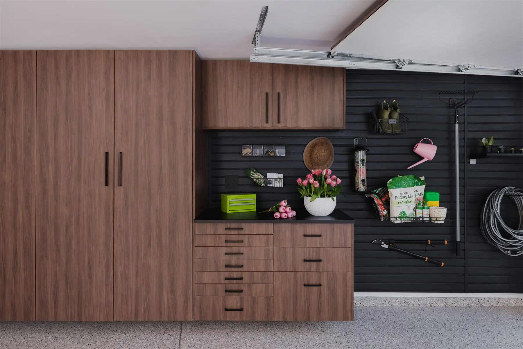 Gardening tools on slatwall by Famille Closets