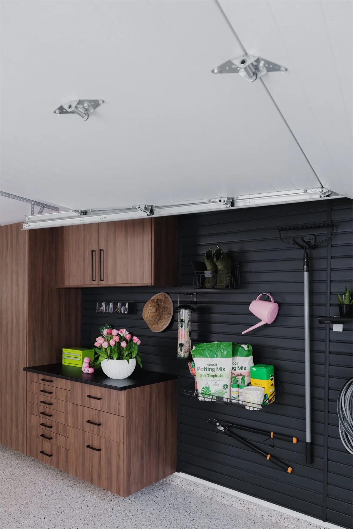 Workbench with slatwall above by Famille Closets