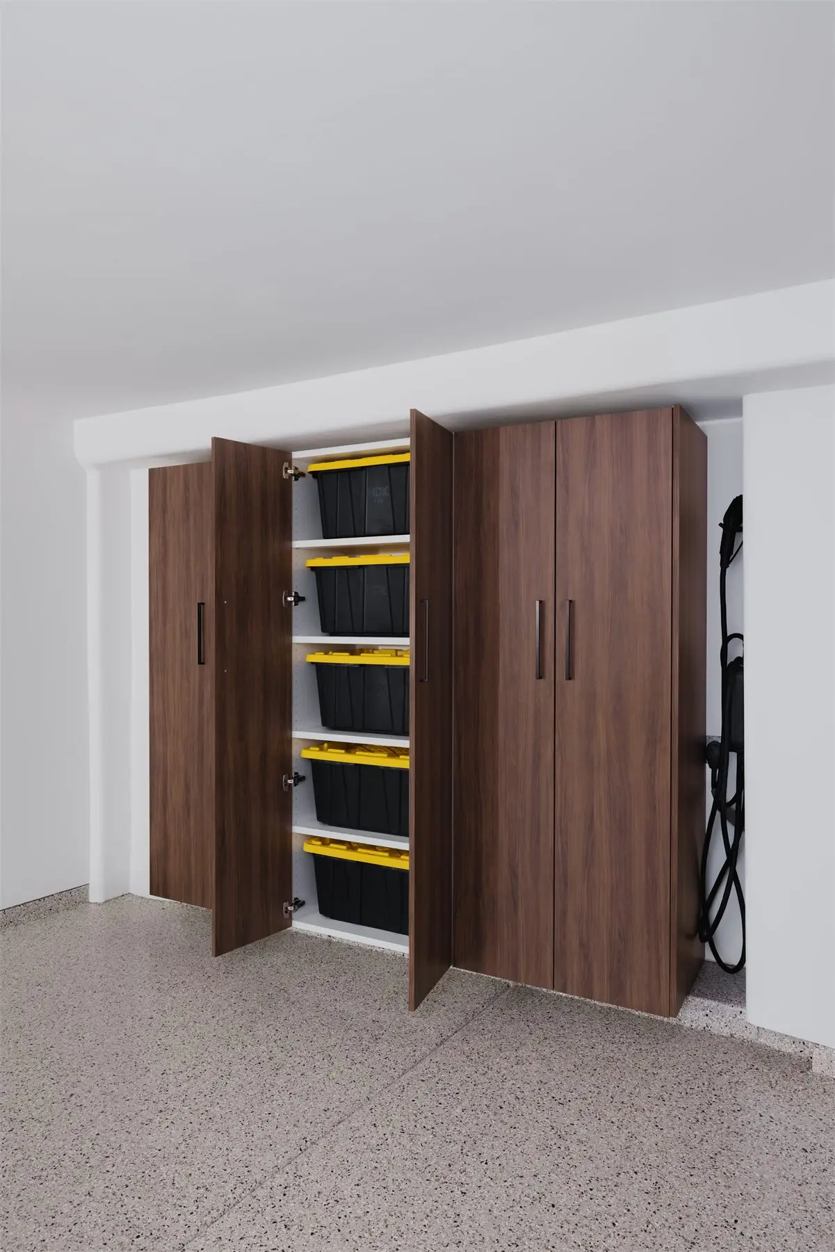 Garage cabinet with storage bins by Famille Closets
