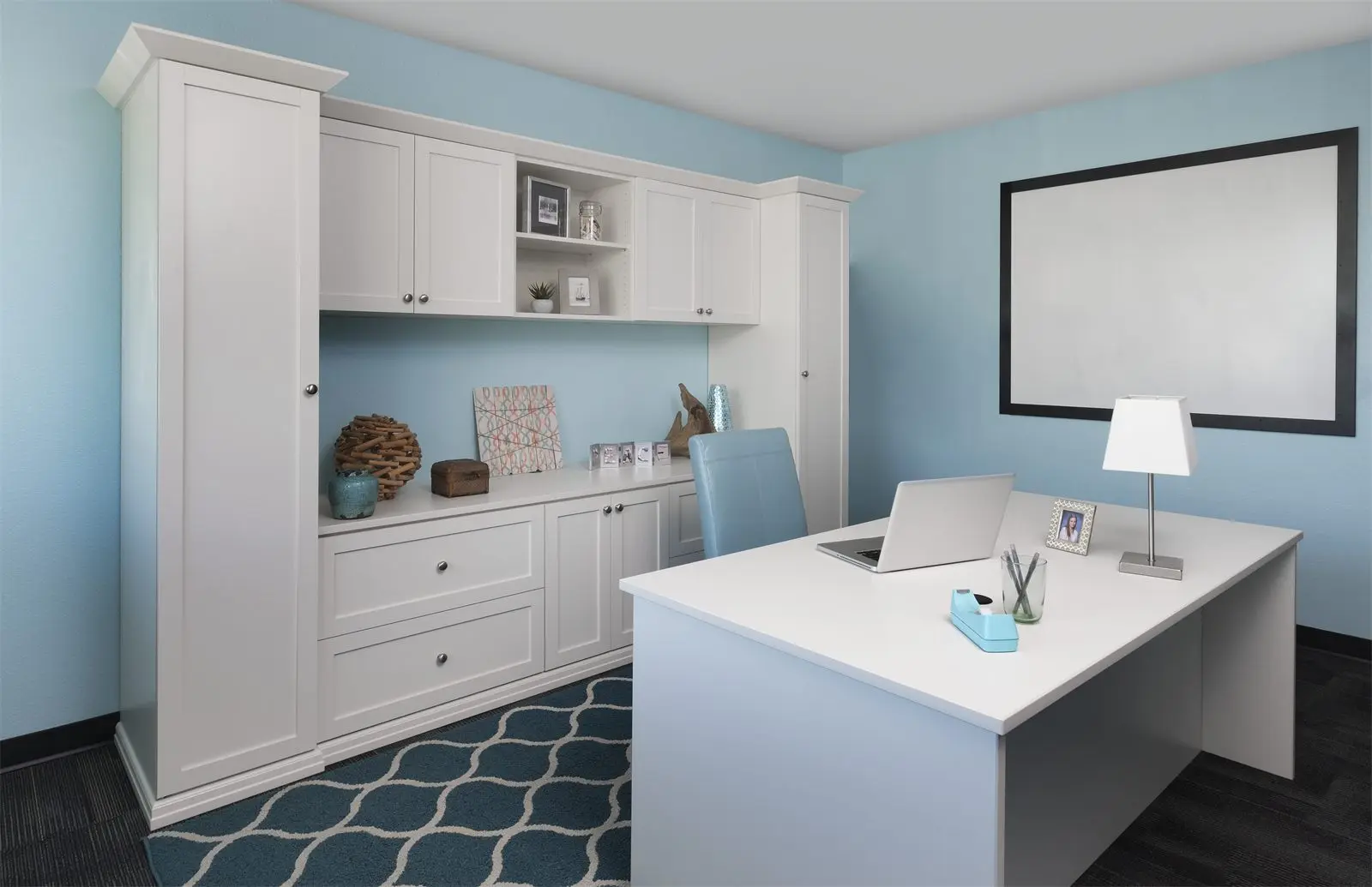 Antique white shaker office wall with drawers, display shelves and a separate desk by Famille Closets