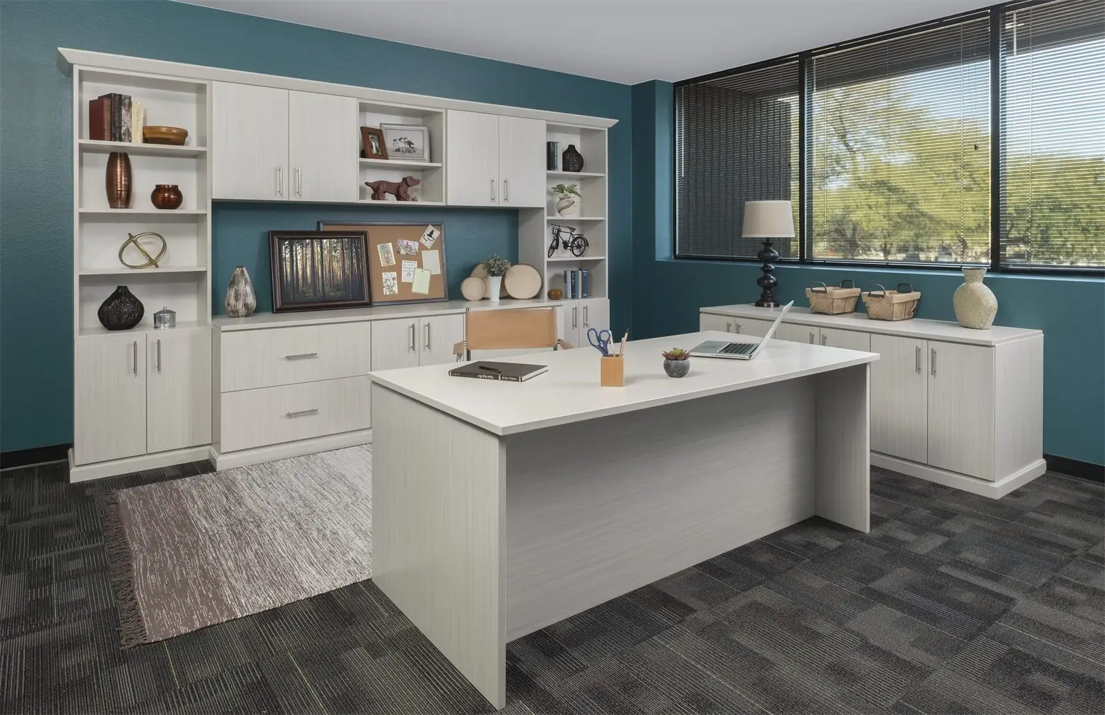 White flat-panel home office with a freestanding desk, bookshelves and a credenza by Famille Closets