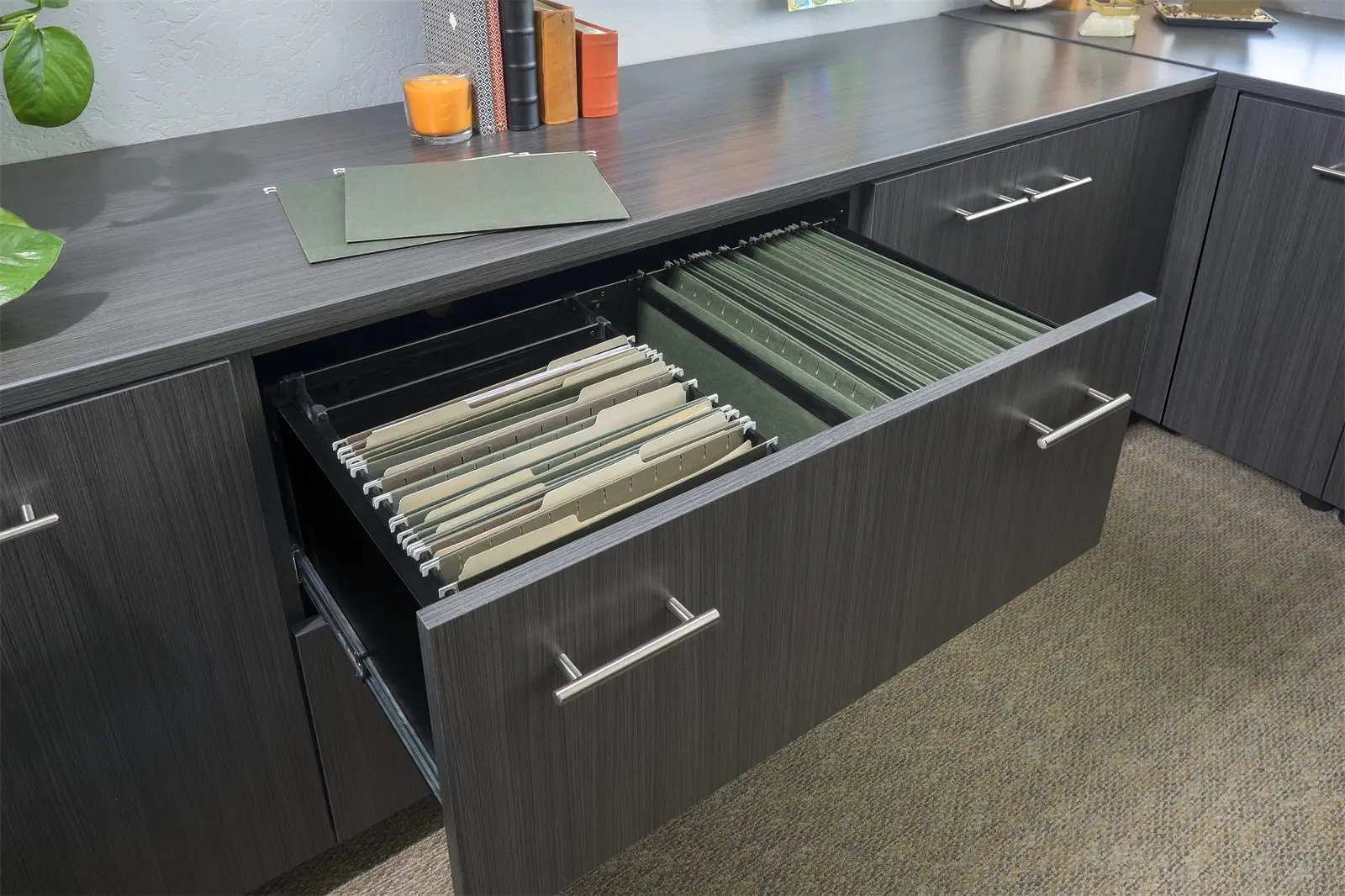 Dark woodgrain office desk with an open file drawer by Famille Closets