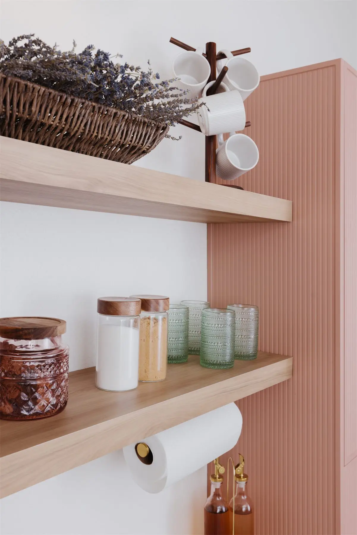 Floating shelves with jars and mugs by Famille Closets