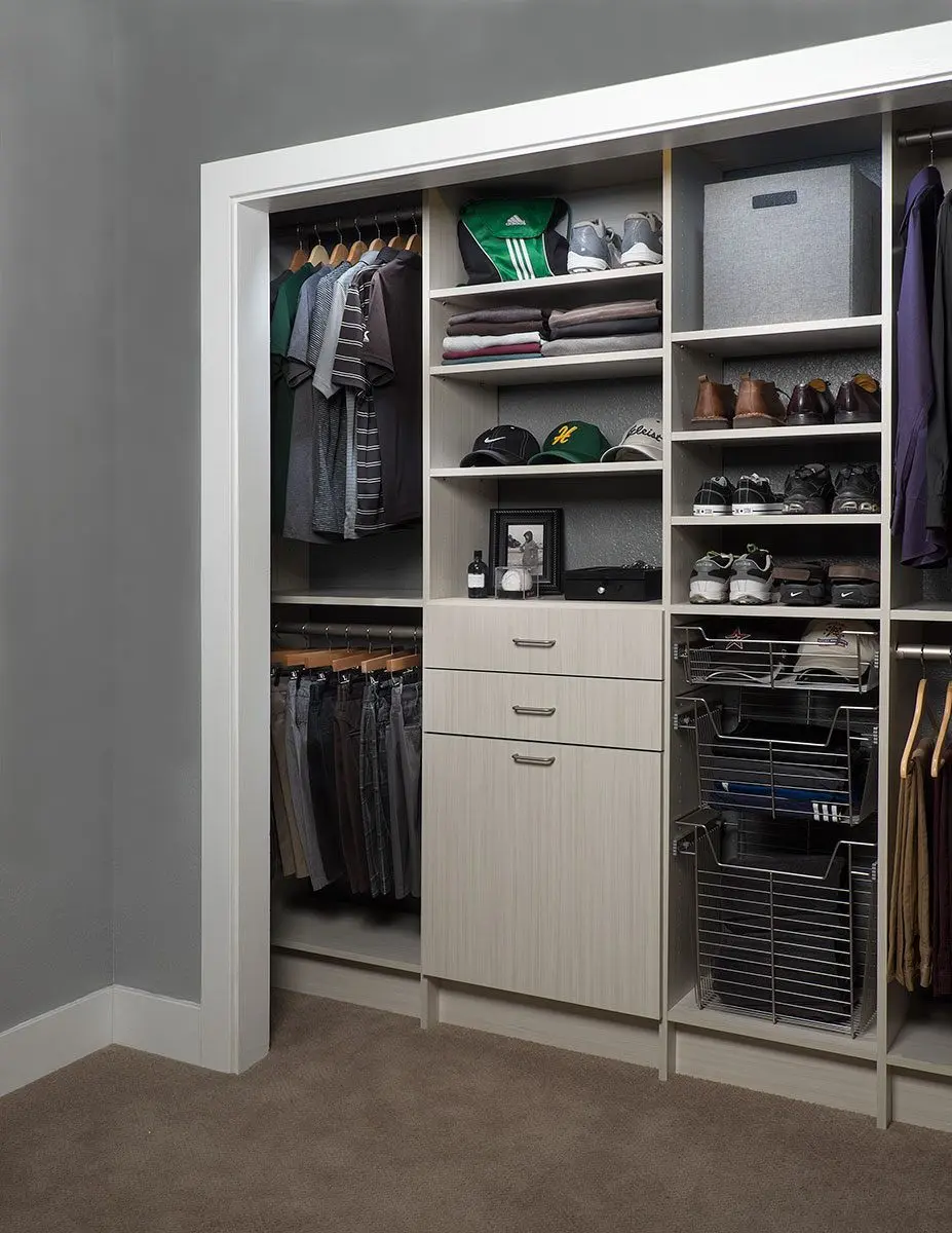 Reach-in closet with shoe shelves and drawers by Famille Closets