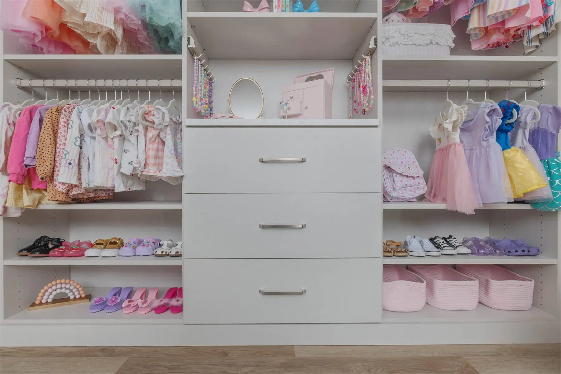 Lower drawers in a kids closet by Famille Closets