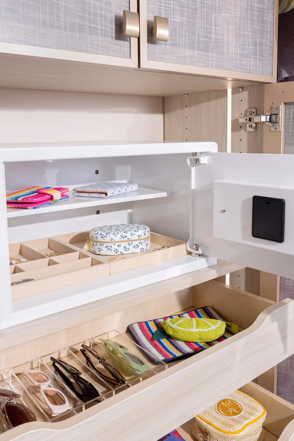 Built-in closet safe and accessory drawers by Famille Closets
