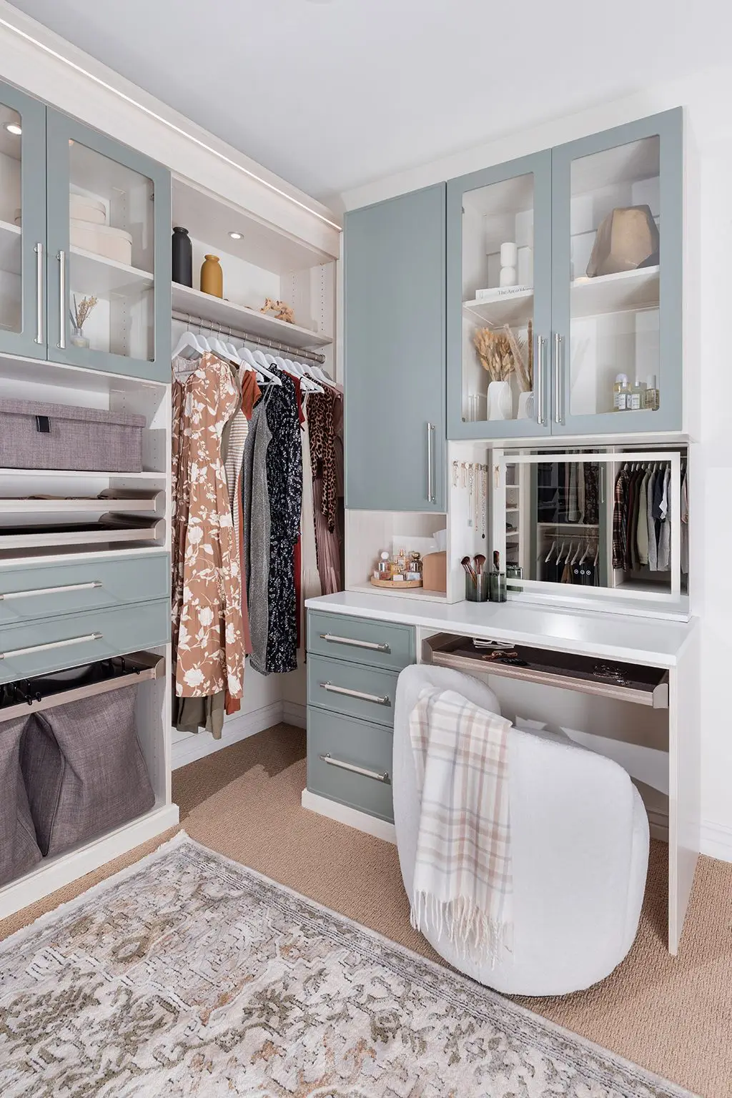 Walk-in closet vanity with mirror by Famille Closets
