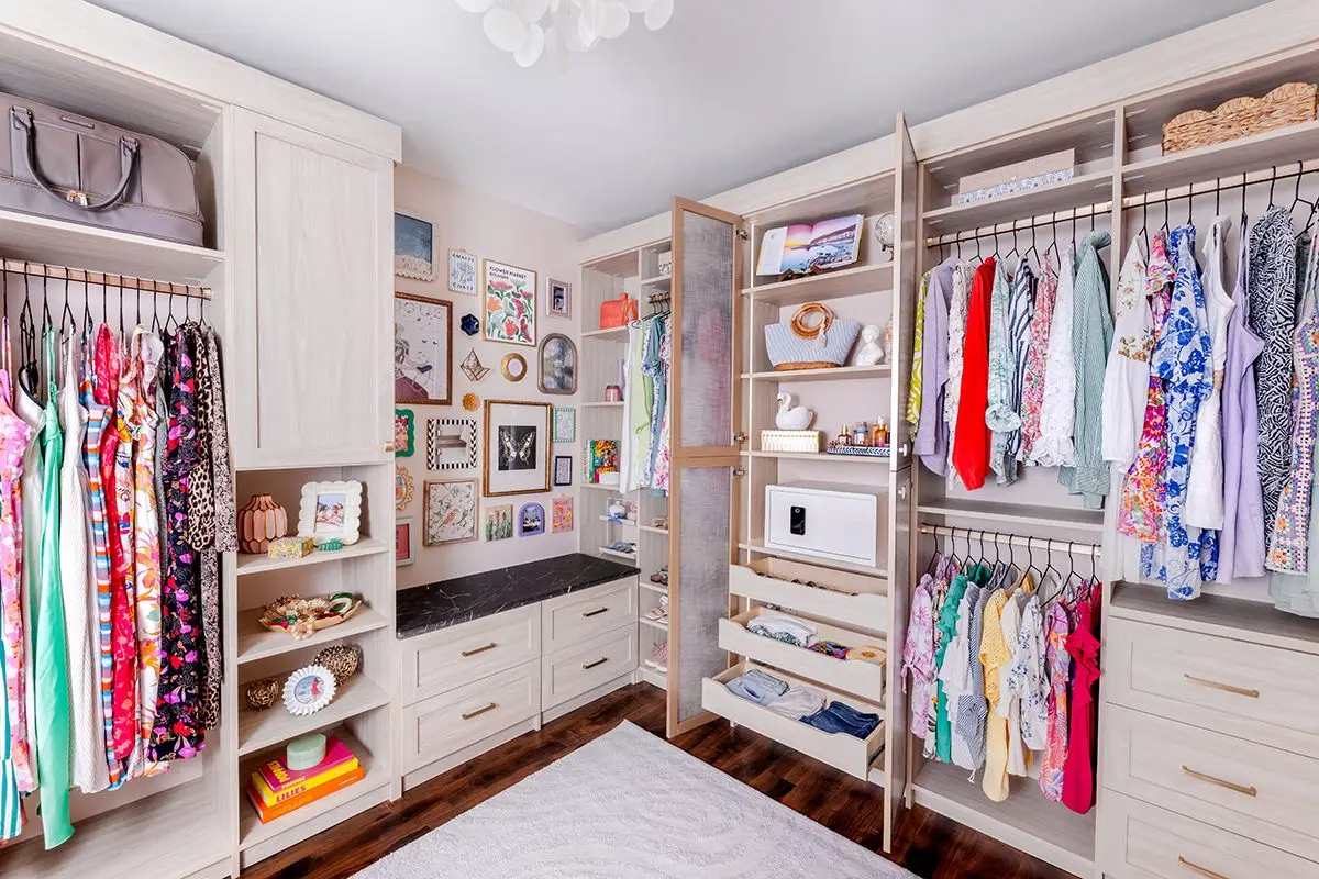 Shaker closet with doors and drawers open by Famille Closets