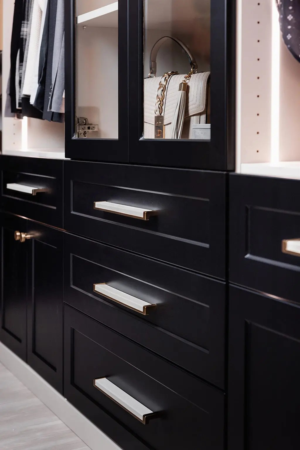 Black closet drawers with woodgrain top by Famille Closets