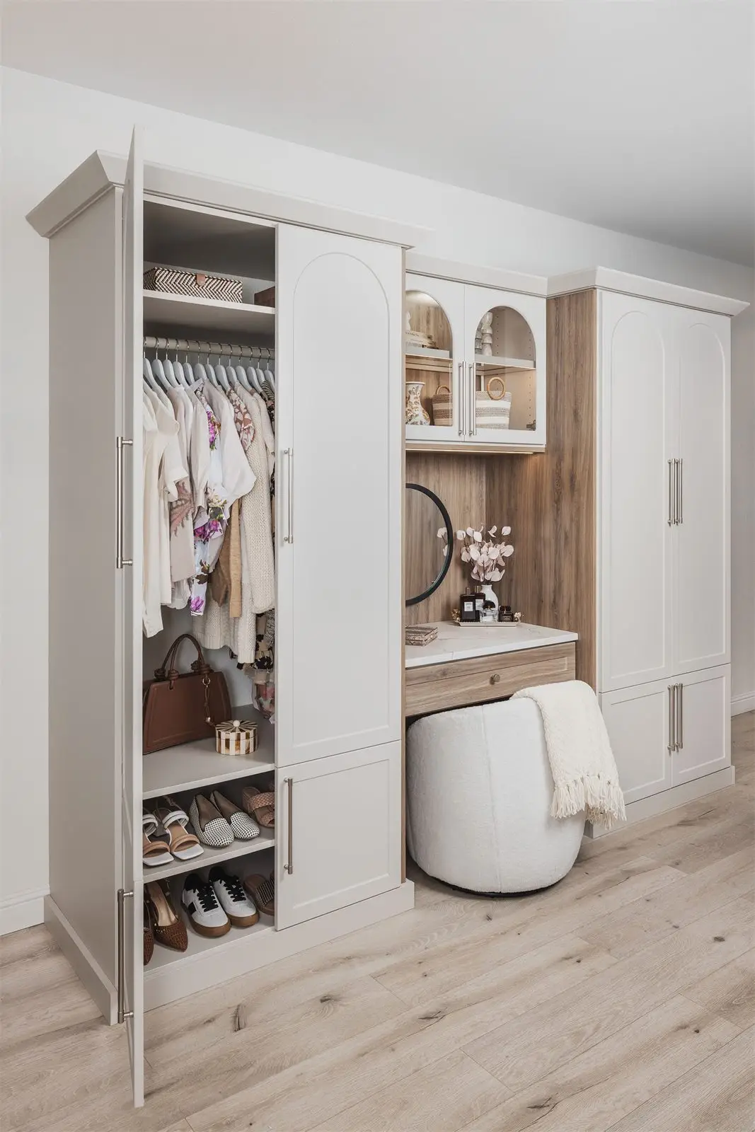 Wardrobe with doors open showing hanging and shoe shelves by Famille Closets