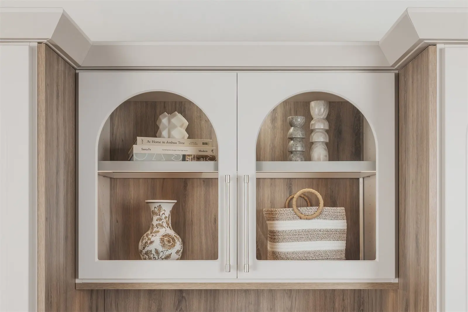 Arched glass-front upper cabinets with lit display shelves by Famille Closets